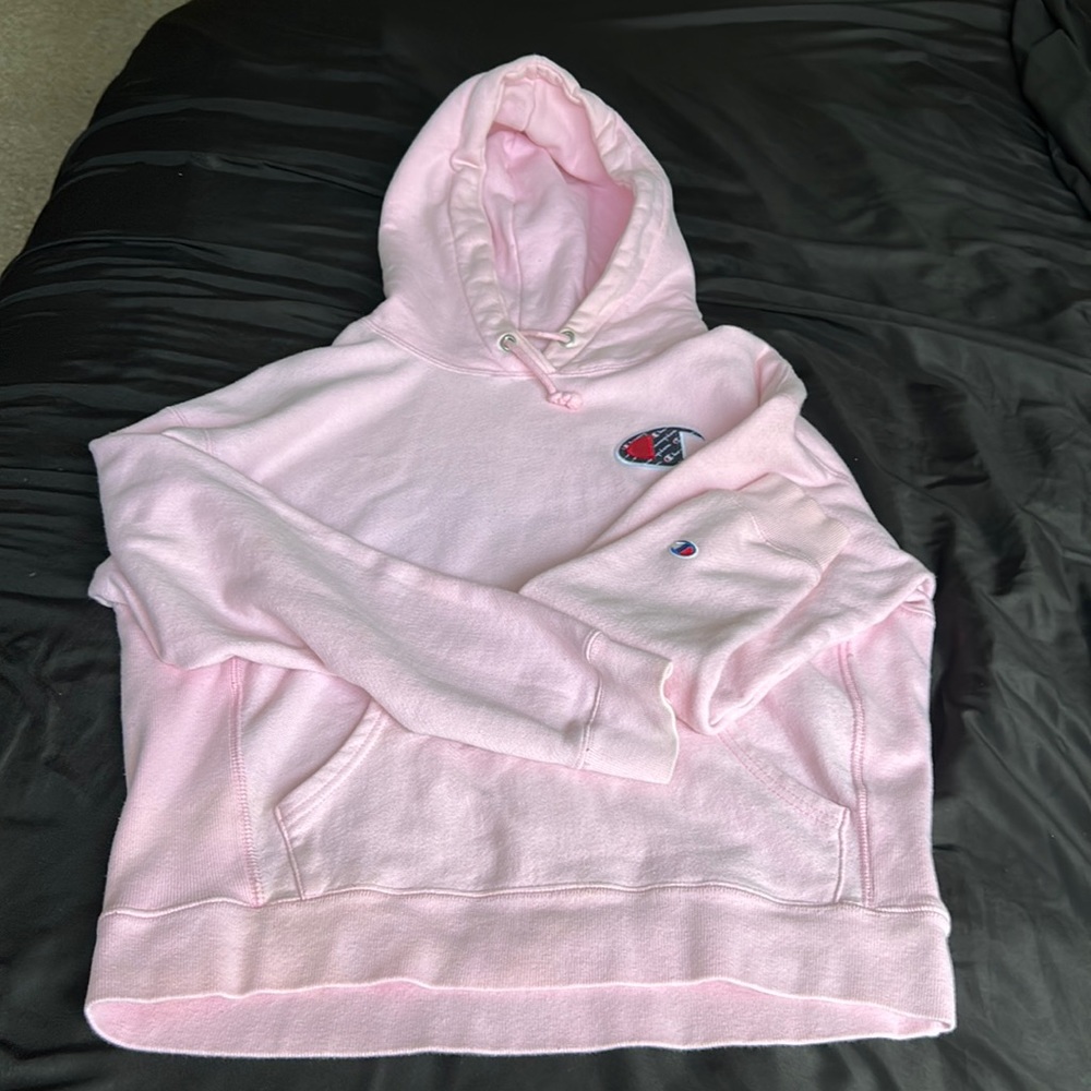 A light pink champion sweatshirt